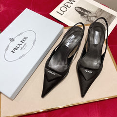 SLINGBACK PUMPS IN BLACK SILK AND SHEEPSKIN LINING WITH TRIANGLE LOGO