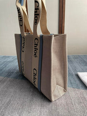 MEDIUM STRAP WOODY TOTE BAG 37 IN BEIGE LINEN CANVAS BLACK WEBBING LOGO EMBROIDER BLUE CALFSKIN