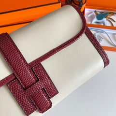 JIGE ELAN 29 CLUTCH IN WHITE CALFSKIN WITH GARNET RED LIZARD SKIN