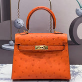KELLY BAG 20 IN FIRE ORANGE OSTRICH LEATHER WITH GOLD HARDWARE