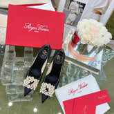 EFFLORESCENCE POINTED-TOE PUMPS IN BLACK SATIN WITH CRYSTAL BUCKLE