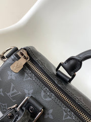 KEEPALL BANDOULIÈRE 25 IN BLACK MONOGRAM HERITAGE CANVAS