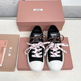 WASHED-DENIM SNEAKERS IN BLACK CANVAS WITH BROWN AND STRIPED LACES