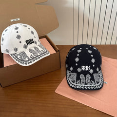 MM BASEBALL CAP IN WHITE WITH BLACK EMBROIDERED PATTERN