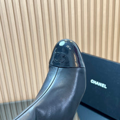 CHANEL 25S BOOTS WITH PATENT TOE CAP 50MM IN BLACK CALFSKIN