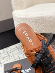 PRADA 25S DEXUN MULE IN BURNT ORANGE SUEDE LEATHER