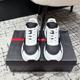 PRADA 25S MEN SNEAKERS IN BLACK AND WHITE CANVAS