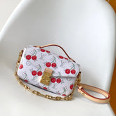 POCHETTE MÉTIS EAST WEST 21.5 IN WHITE WITH CHERRY PRINT MONOGRAM