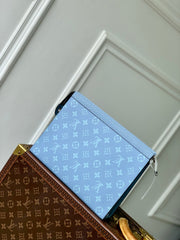 POCHETTE VOYAGE 26 IN LIGHT BLUE MONOGRAM ECLIPSE CALFSKIN