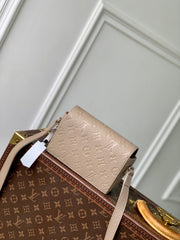 STEAMER WEARABLE WALLET 18 IN LIGHT BROWN MONOGRAM TAURILLON CALFSKIN