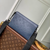 POCHETTE VOYAGE 22 IN DARK BLUE MONOGRAM SHADOW CALFSKIN