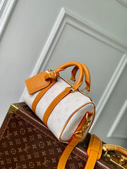 KEEPALL BANDOULIÈRE 25 IN WHITE MONOGRAM HERITAGE CANVAS BRWON CALFSKIN