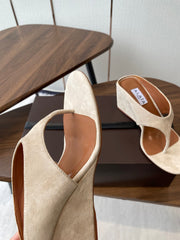 ALAIA WEDGE THONG SANDALS 25S IN LIGHT BEIGE SUEDE