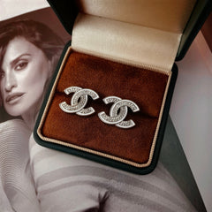 DOUBLE C STUD EARRINGS WITH WHITE TRIM AND CLEAR STONE LOGO