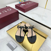 THONG SANDALS IN BLACK LAMBSKIN WITH GOLD HARDWARE
