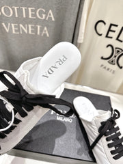 PRADA 25S MULES IN WHITE WITH METAL TOECAP