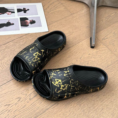 POOL GRAFFITI CROCS SLIDE SANDALS IN BLACK AND YELLOW RUBBER