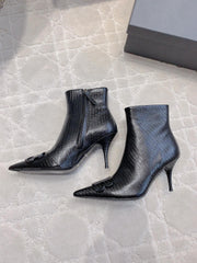 POINTED-TOE HIGH HEEL BOOTS IN BLACK LIZARD EMBOSSED CALFSKIN