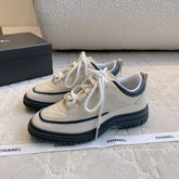 CHANEL 25S TRAINERS 40MM IN WHITE AND BLACK CALFSKIN