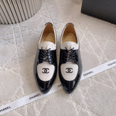 CHANEL 25S TWO TONE LACE UP IN BLACK AND WHITE SHINY CALFSKIN