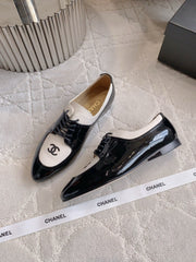 CHANEL 25S TWO TONE LACE UP IN BLACK AND WHITE SHINY CALFSKIN