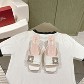 CRYSTAL HEEL MULE IN WHITE SHINY CALFSKIN WITH EMBELLISHED BUCKLE