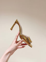 TRUMPET METALLIC MULES IN GOLD PATENT CALFSKIN