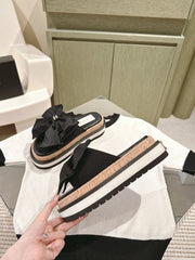 CC SLIPPERS WITH SILK BOW IN BLACK COWHIDE