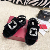 VIV' WINTER FUR STRASS BUCKLE SANDALS IN BLACK SHEEPSKIN
