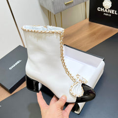 CHANEL 25S HEELED CHAIN BOOTS WITH BOW IN WHITE CALFSKIN GOLD HARDWRE