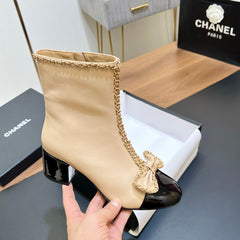 CHANEL 25S HEELED CHAIN BOOTS WITH BOW IN BEIGE CALFSKIN GOLD HARDWRE