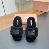 SLIPPERS IN BLACK LAMB WOOL