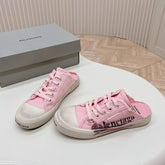 SNEAKER MULES IN PINK CANVAS GRAFFITI LOGO