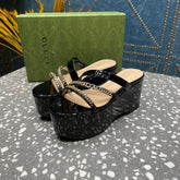 HIGH WEDGE PLATFORM IN BLACK CALFSKIN WITH GOLD HARDWARE