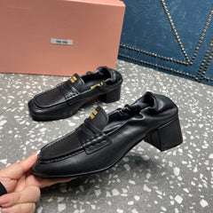HIGH BROGUE LOAFERS IN BLACK LAMBSKIN