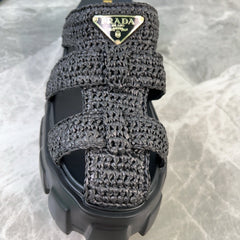 PRADA 25S MONOLITH RUBBER MULES IN BLACK RAFFIA AND LAMBSKIN