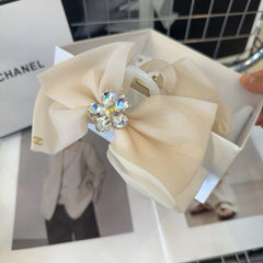 BEIGE CREAM VOILE FABRIC AND RESIN CLAW CLIP 432859