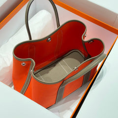 GARDEN PARTY 30CM IN ORANGE MINIMUM TOILETS COTTON CANVAS AND BROWN CALFSKIN