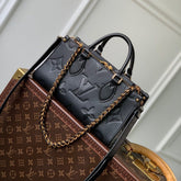 ONTHEGO EAST WEST BAG 25 IN BLACK MONOGRAM EMBOSSED COWHIDE