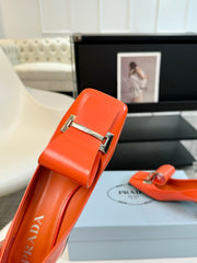 SQUARE TOE PUMPS IN INTERNATIONAL ORANGE GLOSSY CALFSKIN ATTACHED BOW