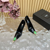 GREEN GEM-STUDDED HIGH PUMPS IN BLACK PATENT CALFSKIN