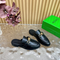 OPEN-BACK LOAFER REALISED IN BLACK SOFT CALFSKIN WITH SIGNATURE METALLIC KNOT DETAIL