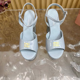 PLATFORM HEELS IN BABY BLUE PATENT CALFSKIN GOLD LOGO IN STRAP