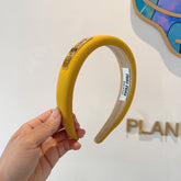 THICK HEADBAND IN YELLOW DIAGONAL LEATHER 425478