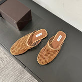 ALAIA FLAT MULES IN COPPER BROWN MESH FISHNET
