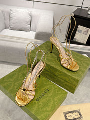 STRAPPY SANDAL WITH RHINESTONE CHAIN IN GOLD PATENT LEATHER