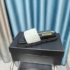 KNIT SLIPPERS IN LIGHT PINK WOVEN SATIN AND BLACK SHEEPSKIN