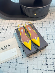 ALAIA FLAT SLINGBACK IN YELLOW PATENT CALFSKIN AND FILM