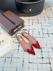 ALAIA FLAT SLINGBACK IN CHERRY RED PATENT CALFSKIN AND FILM