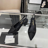 CHANEL 25S SANDALS WITH A BOW 60MM IN SPARKLING BLACK CANVAS